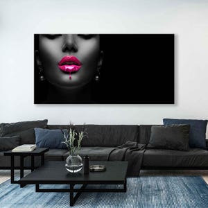 May include: A black and white portrait of a woman with bright pink lipstick dripping down her chin. The background is black.