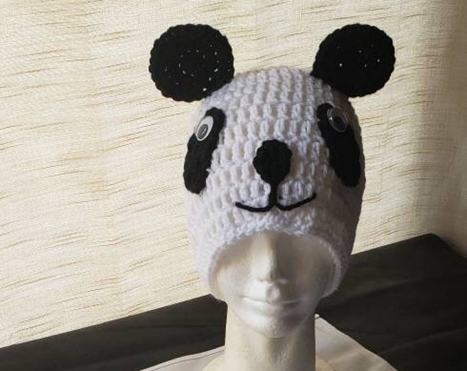 Child size panda hat with matching hand purse.