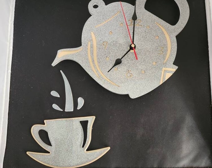 Tipping teapot wall clock