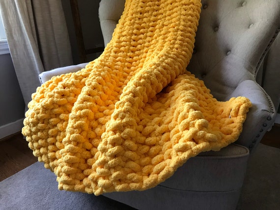 Yellow yarn blanket deals
