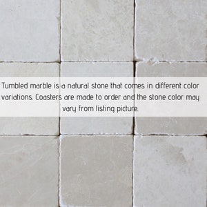 May include: Close-up of a grid of square, off-white tumbled marble coasters. The text in the image reads: "Tumbled marble is a natural stone that comes in different color variations. Coasters are made to order and the stone color may vary from listing picture."