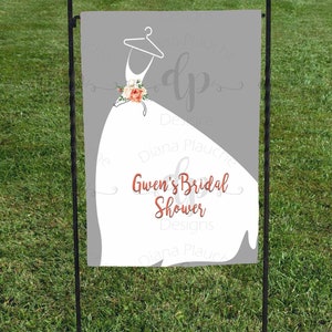 May include: A white bridal shower sign with a silhouette of a wedding dress and floral accents. The text reads "Gwen's Bridal Shower" in a coral color.