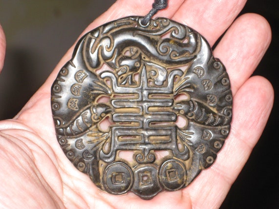 All natural dark black green jade hand carved two sided bat pendant.