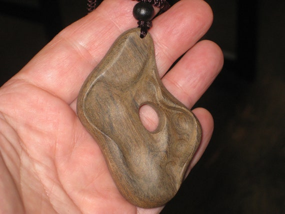 Hand carved Sandalwood pendant, with adjustable necklace.