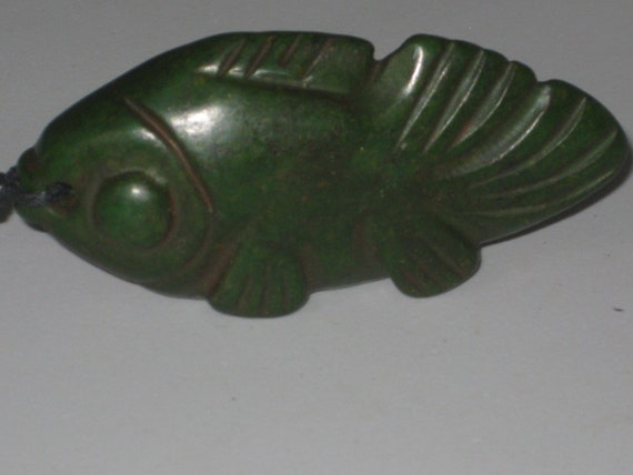 All natural hand carved two sided very old Jade fish pendant, or statue.