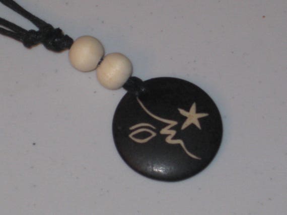 Ox bone pendant and wood beads, with adjustable necklace.
