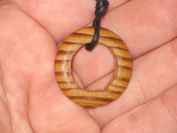 Hand carved Canadian pine O pendant, with adjustable necklace.
