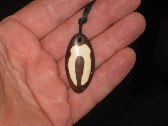 Buffalo bone African tribal, hand carved pendant.