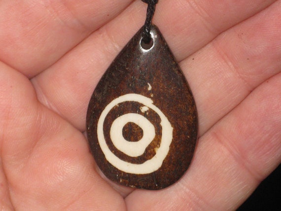 Buffalo bone African tribal, hand carved pendant.