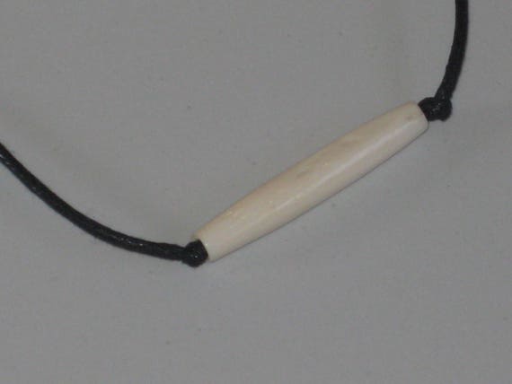 Hand carved bone tube pendant, with adjustable necklace.