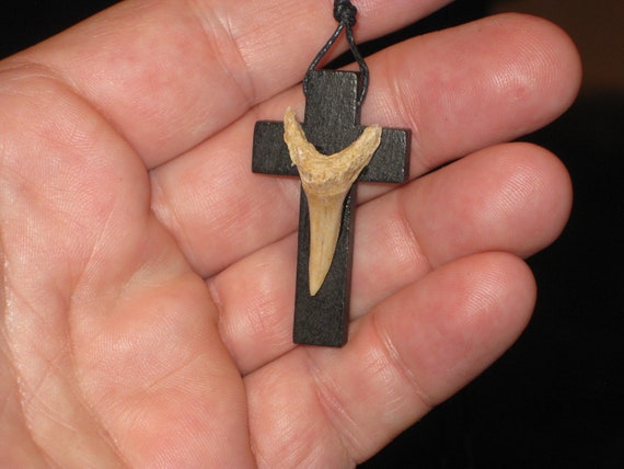 Hand carved wood cross and fossil shark tooth from Morocco, with adjustable necklace.