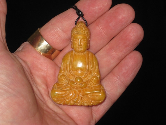 All natural hand carved Jade Buddha pendant, with adjustable necklace.
