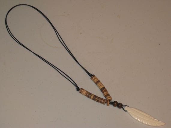 Buffalo bone pendant and heishi wood beads, with adjustable necklace.