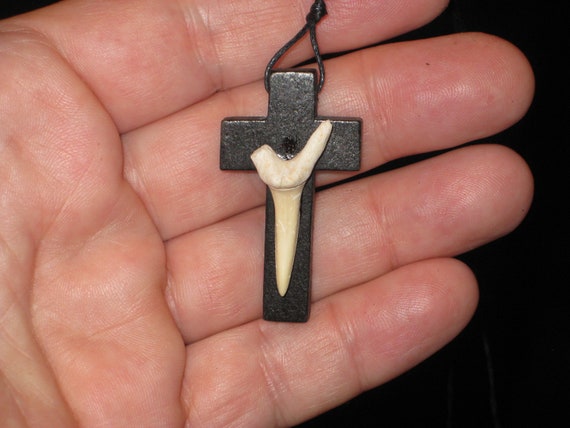 Hand carved wood cross and fossil shark tooth from Morocco, with adjustable necklace.