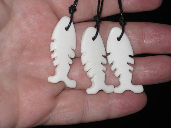 3 Buffalo bone fish pendants, with adjustable necklace.
