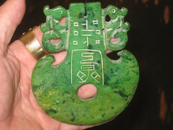 Very old hand carved two sided Jade pendant, with adjustable necklace.