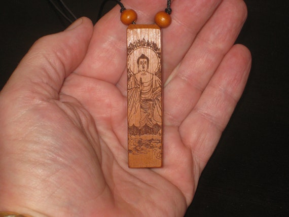 Hand carved rosewood pendant with wood beads.