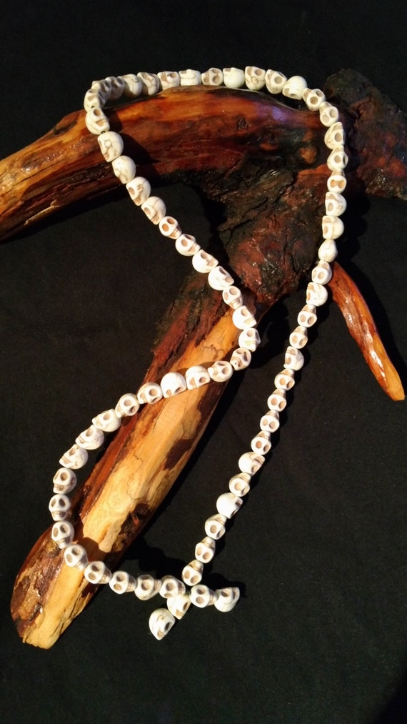 Howlite skull necklace, 26" long.