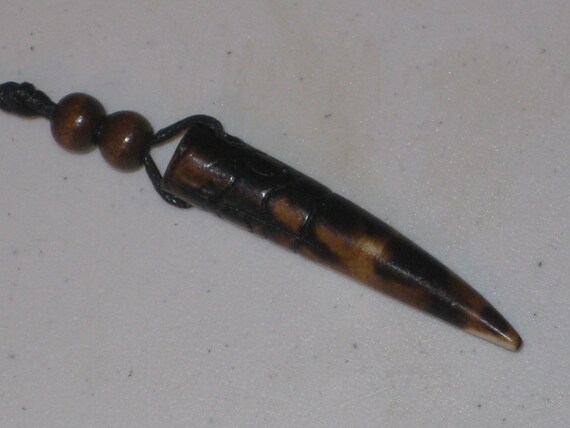 Hand carved Bone primitive tooth.