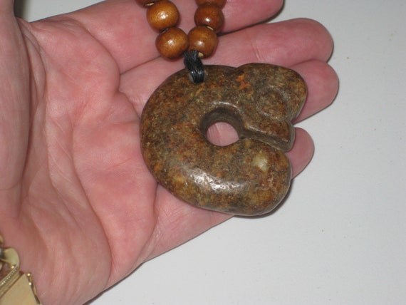 Primitive hand carved old jade stone head amulet pendant, necklace is adjustable up to 32" long.