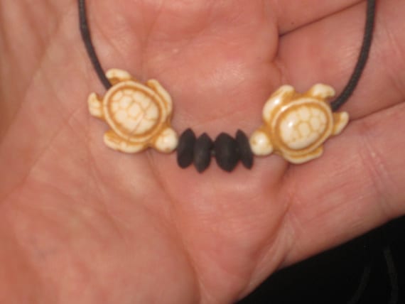 White stone turtle surfer pendants, with adjustable necklace.