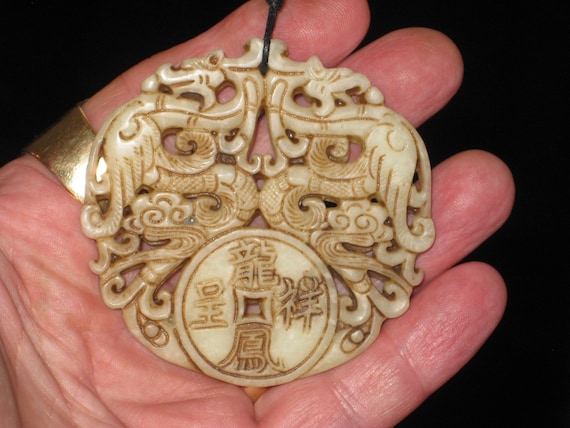 All natural jade hand carved two sided phoenix pendant, with adjustable necklace.