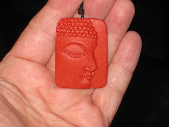 Organic Cinnabar buddha pendant, with adjustable necklace.