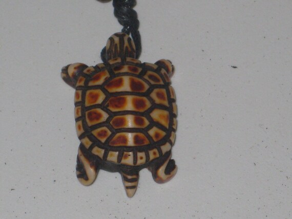 Surfers turtle necklace, adjustable up to 32" long.