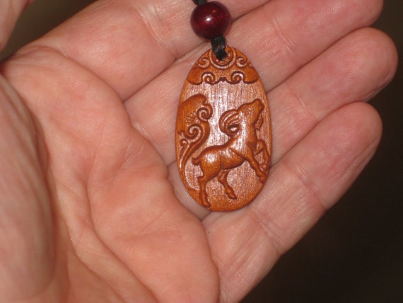 Hand carved Chinese Zodiac sign rosewood necklace (Ram), 24" long.