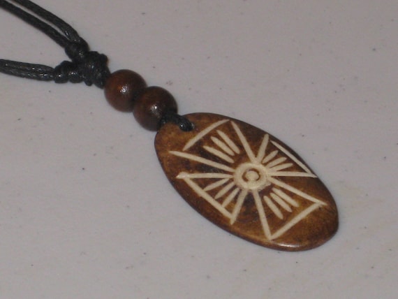Hand carved primitive African design pendant, Buffalo bone.