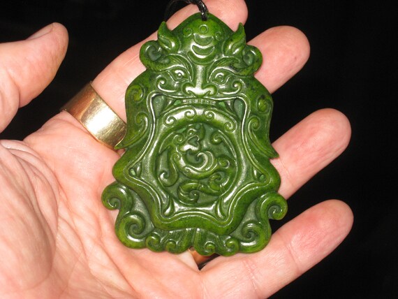 All natural hand carved Hetian Jade Warrior and dragon pendant.