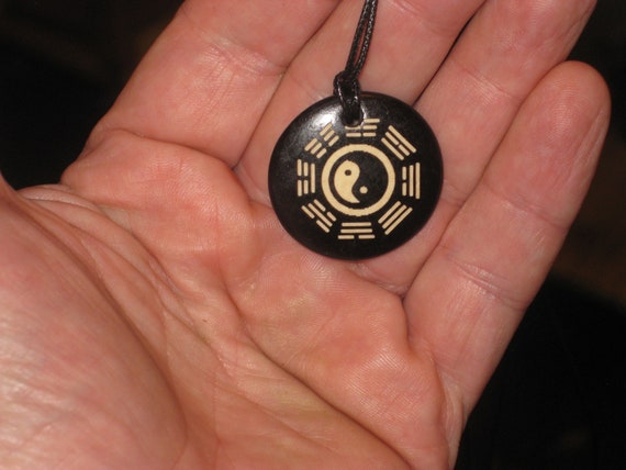Ox bone pendant with adjustable necklace.