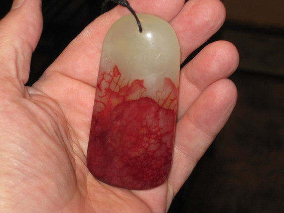 Hand carved blood red agate pendant with adjustable necklace.