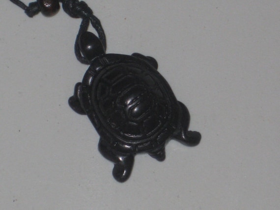 Surfers black turtle necklace, adjustable up to 32" long.