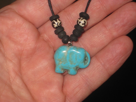 Turquois elephant surfer pendant, with adjustable necklace.