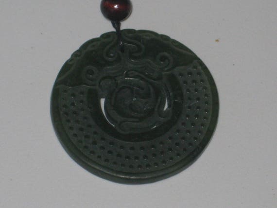 All natural hand carved two sided very old Jade dragon pendant, with adjustable necklace.
