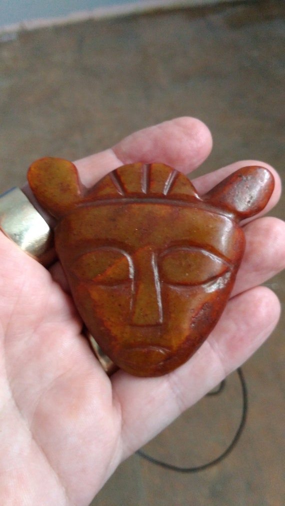 All natural hand carved Jade mask pendant, with adjustable necklace.