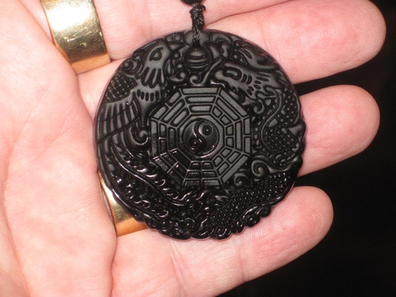Black Obsidian dragon and phoenix ying yang pendant, with glass bead necklace.