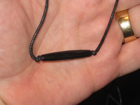 Buffalo bone hand carved piping pendant, with adjustable necklace.