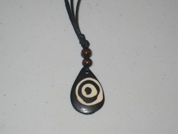 Hand carved primitive African design pendant, Buffalo bone.