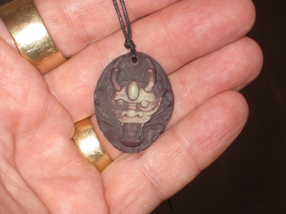 All natural hand carved Jade stone dragon pendant, with adjustable necklace.
