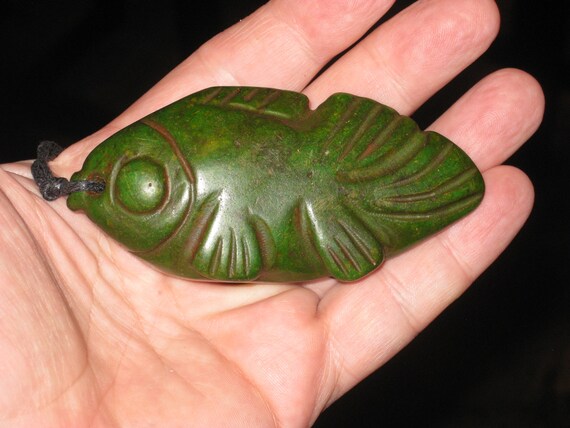 All natural hand carved two sided very old Jade fish pendant, or statue.