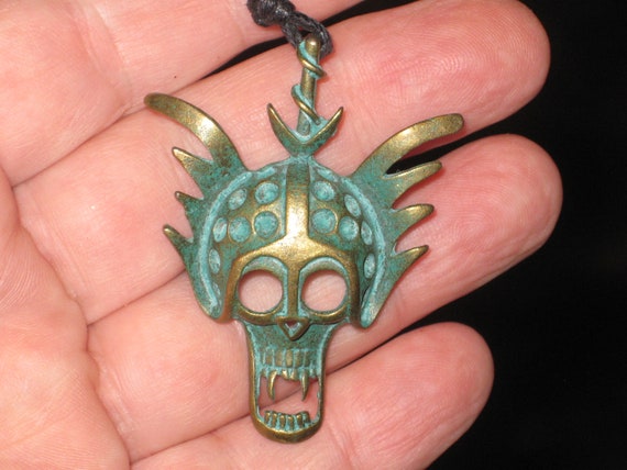 Iodized brass skull warrior mask, with adjustable necklace.