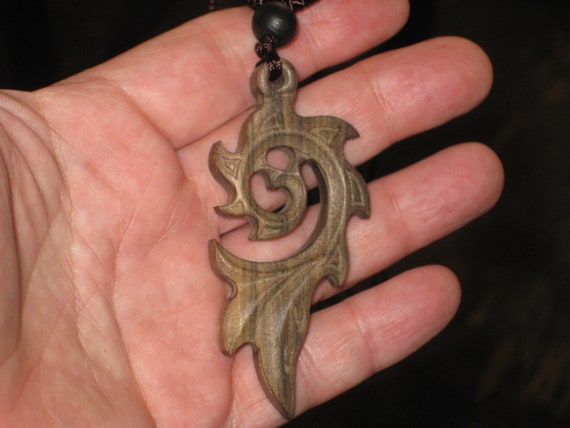 Hand carved Sandalwood pendant, with adjustable necklace.
