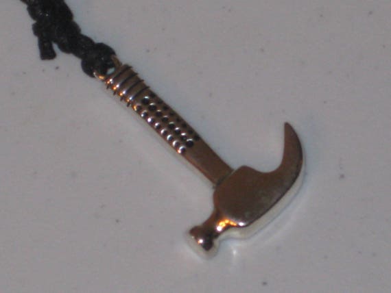The handymans hammer pendant, hand made.