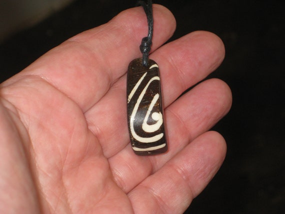 Buffalo bone African tribal, hand carved pendant.