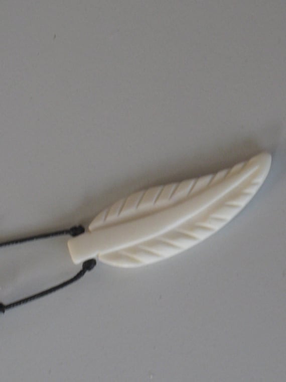 Hand carved buffalo bone pendant, with adjustable necklace.