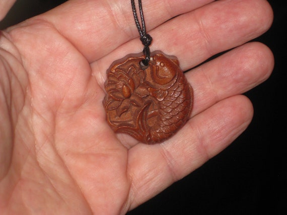 Hand carved rosewood fish pendant, adjustable necklace.