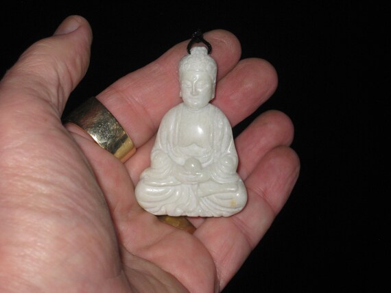 All natural hand carved Jade Buddha pendant, with adjustable necklace.