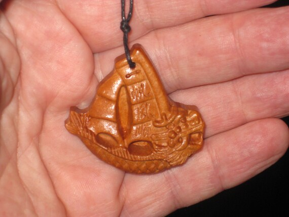 Hand carved rosewood dragon sail boat pendant, adjustable necklace.